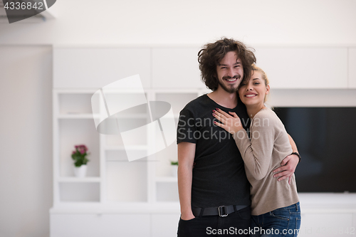 Image of couple hugging in their new home