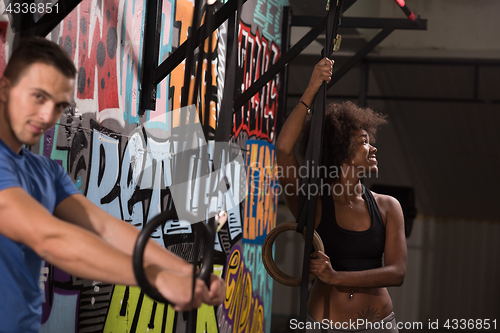 Image of Portrait of multiethnic couple  after workout at gym