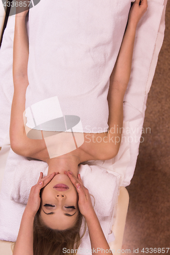 Image of woman receiving a head massage