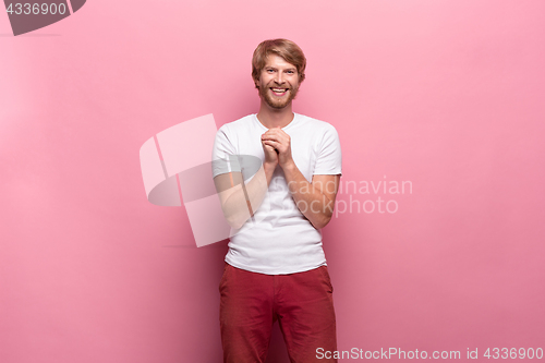 Image of Portrait of young man with happy facial expression