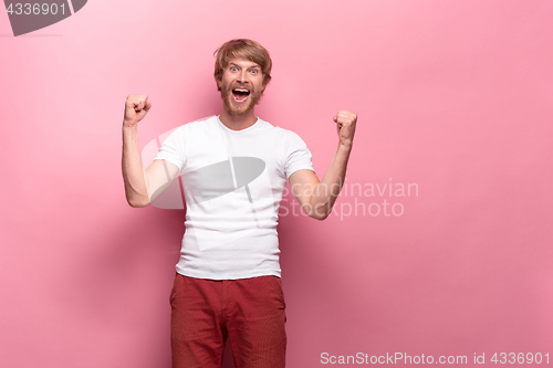 Image of Portrait of young man with happy facial expression