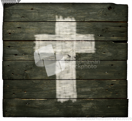 Image of christian cross on old wooden planks