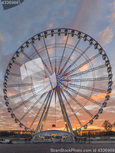 Image of Place de la Concorde at sunset. Ferris wheel and Egyptian obelis