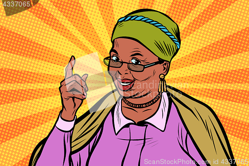 Image of African elderly woman pointing finger up