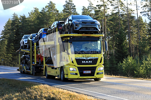 Image of Yellow MAN TGS 18.420 Car Carrier Hauls New Cars