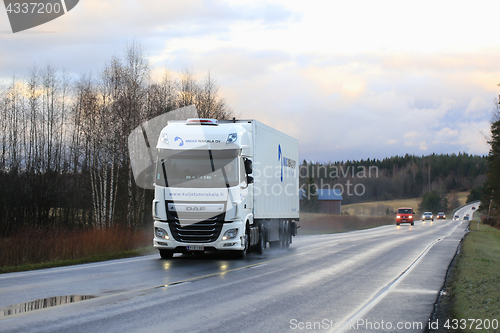 Image of White DAF XF on Road Dusktime 