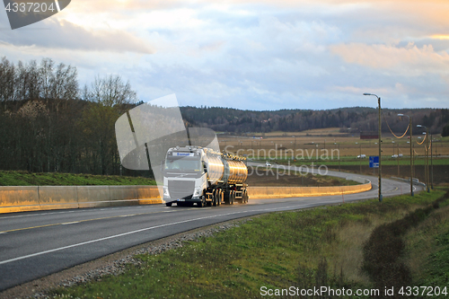 Image of White Volvo FH Tanker Trucking at Sunset