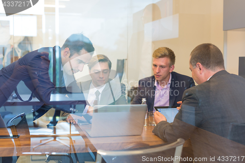 Image of Business people sitting and brainstorming at corporate meeting.