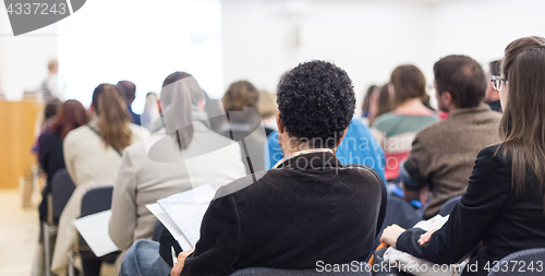 Image of Woman giving presentation on business conference.