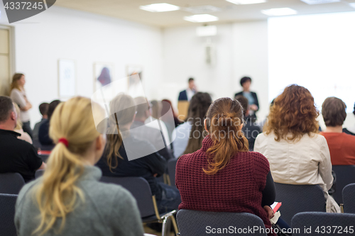 Image of Speaker giving presentation on business conference.