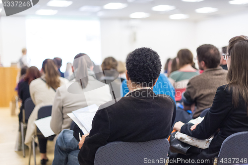 Image of Woman giving presentation on business conference.