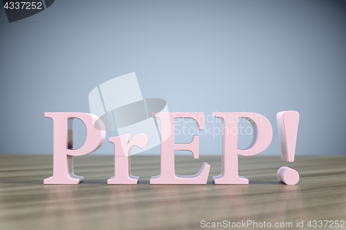 Image of the letters PrEP! on a wooden table