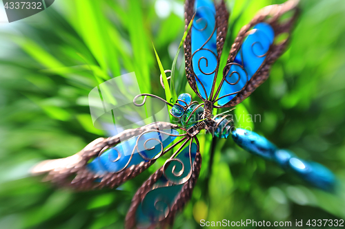 Image of Artificial butterfly in a plant