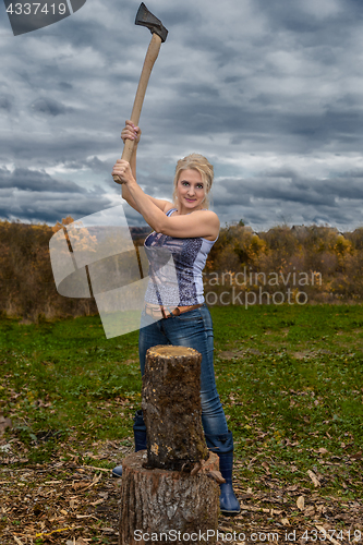 Image of Blonde with axe