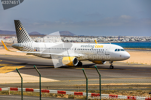 Image of ARECIFE, SPAIN - APRIL, 15 2017: AirBus A320 of vueling.com with