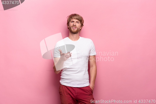 Image of Negative human facial expressions, emotions and feelings. Portrait of squeamish disgusted young man