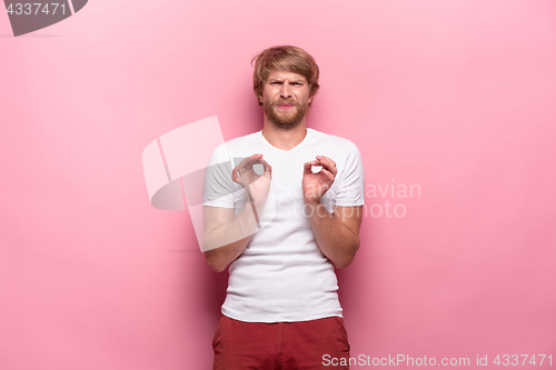 Image of Negative human facial expressions, emotions and feelings. Portrait of squeamish disgusted young man