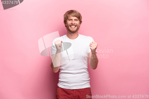 Image of Portrait of young man with happy facial expression