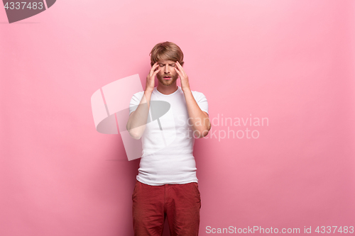 Image of Studio shot of thoughtful young man