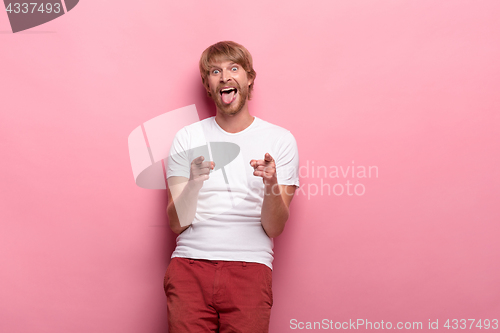 Image of Portrait of young man with happy facial expression