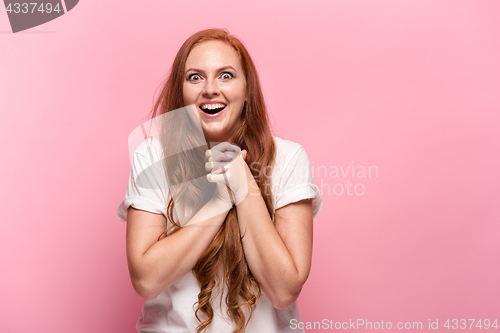Image of Portrait of young woman with happy facial expression