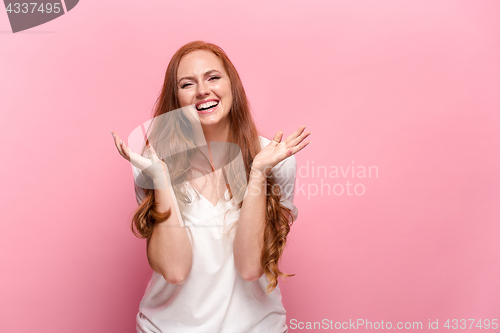 Image of Portrait of young woman with happy facial expression