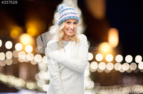 Image of happy woman over christmas lights