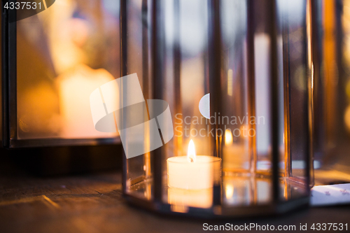 Image of close up of lantern with candle burning inside