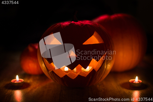 Image of halloween jack-o-lantern burning in darkness