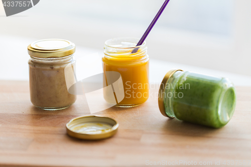 Image of vegetable or fruit puree or baby food in jars