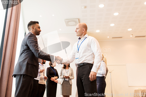 Image of handshake of people at business conference