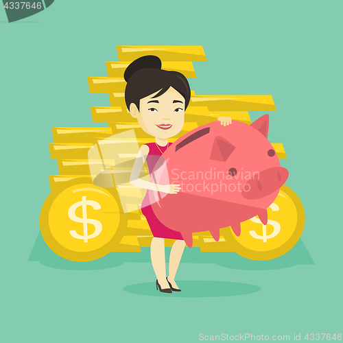 Image of Business woman holding big piggy bank.