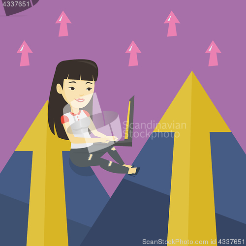 Image of Business woman working on laptop in the mountains.