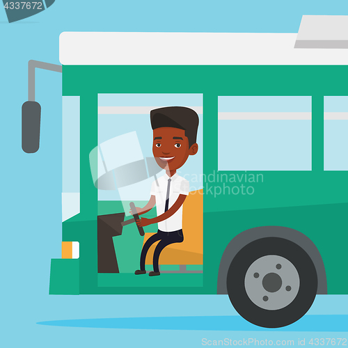 Image of African bus driver sitting at steering wheel.