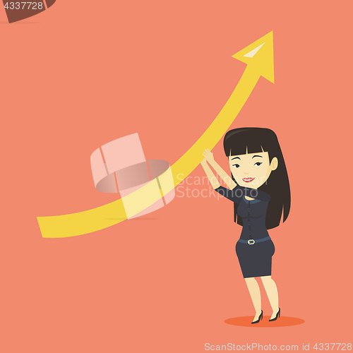 Image of Business woman holding arrow going up.