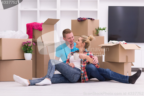 Image of young couple moving  in new house