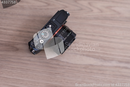 Image of camera on a wooden table