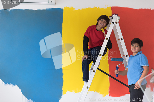 Image of boys painting wall