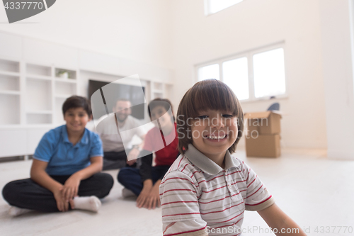 Image of portrait of happy young boys with their dad