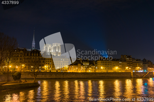 Image of Bridge by the Seine river in Paris at night