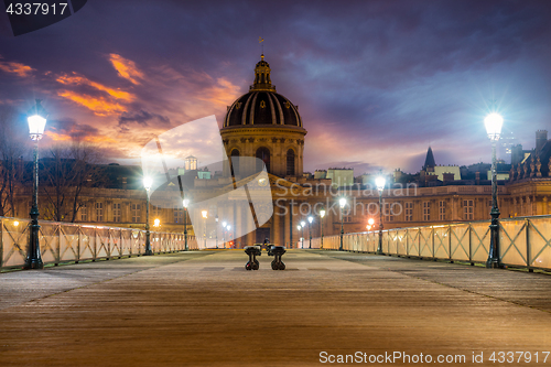 Image of Bridge by the Seine river in Paris at night