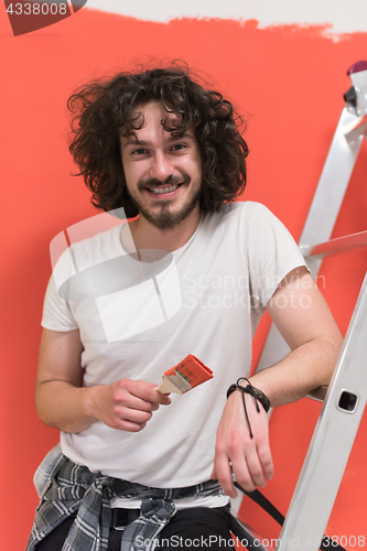 Image of man with funny hair over color background with brush