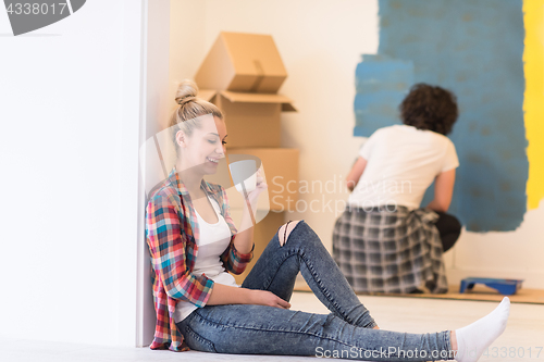 Image of young couple doing home renovations