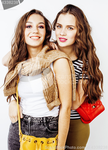 Image of best friends teenage girls together having fun, posing emotional on white background, besties happy smiling, lifestyle people concept close up. making selfie