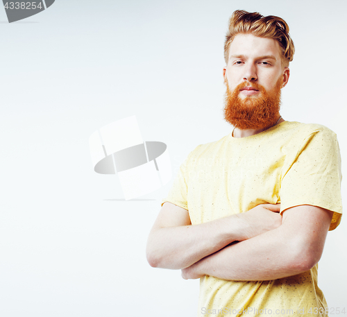 Image of young handsome hipster ginger bearded guy looking brutal isolate