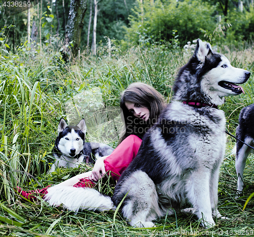 Image of woman in red dress with tree wolfs, forest, husky dogs mystery p