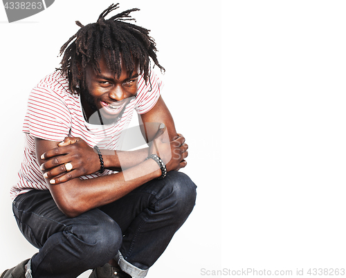 Image of young handsome afro american boy in stylish hipster hat gesturin