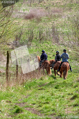 Image of riding horses