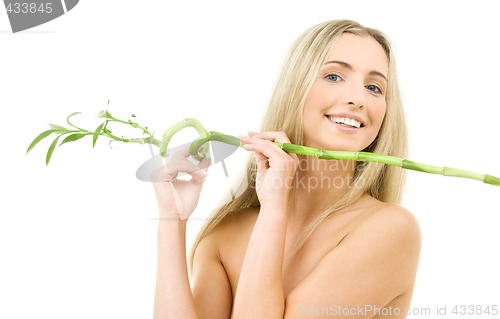 Image of happy blonde with bamboo