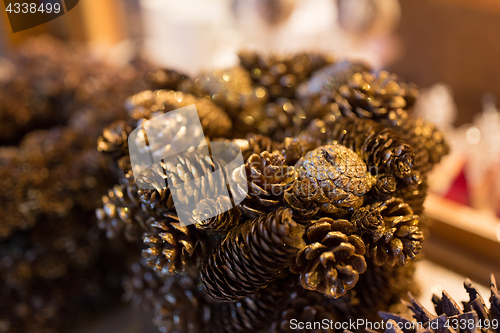 Image of close up of gilded cone christmas decoration
